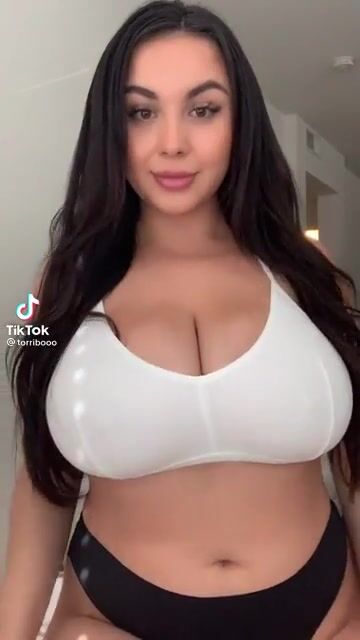 Thot squeezing her big titties together