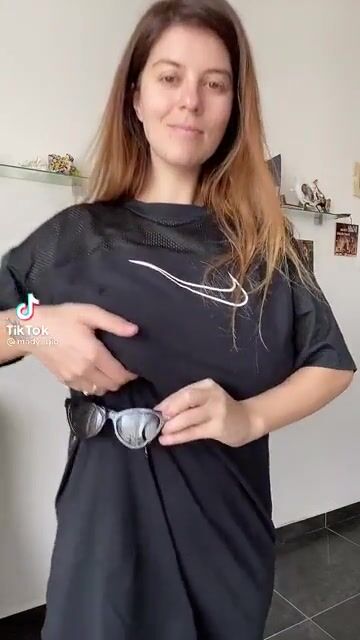 Holding items with her breast