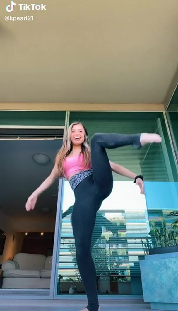 Flexible White Girl Stretching in Yoga Pants