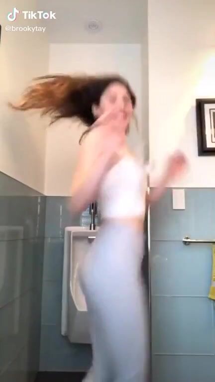 BLM and climate change nuisance protester dances in men's toilet.