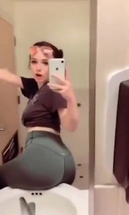 Victoria by the sink of her bathroom