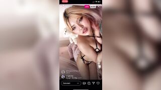 Laying on her side in bed. Korean