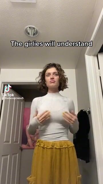 Playing with her titties