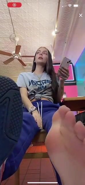 Girl shows sweaty work feet (close-up) on TikTok Live